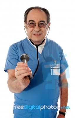 Senior Doctor Checking Heartbeats Stock Photo