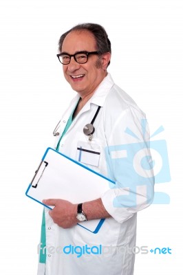 Senior Doctor Holding Clipboard Stock Photo