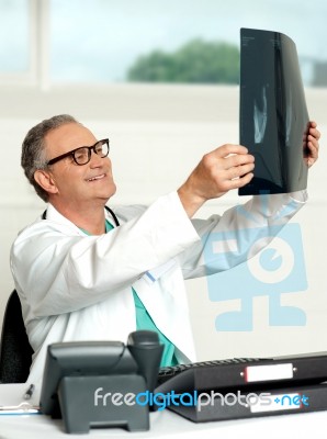 Senior Doctor Holding X Ray Stock Photo