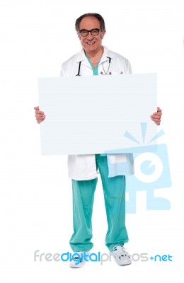 Senior Doctor Showing Blank Board Stock Photo
