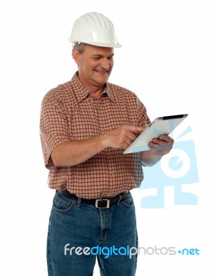 Senior Engineer Using Tablet Stock Photo