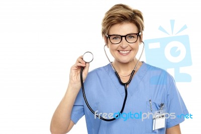 Senior Female Physician Ready To Examine You Stock Photo