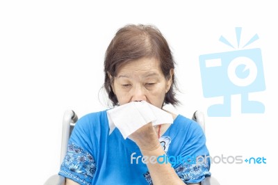 Senior Woman Blowing Her Nose Stock Photo