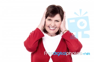 Senior Woman Closing Her Ears With Hands Stock Photo
