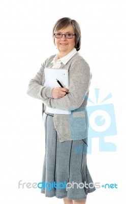 Senior Woman Holding Spiral Notepad Stock Photo