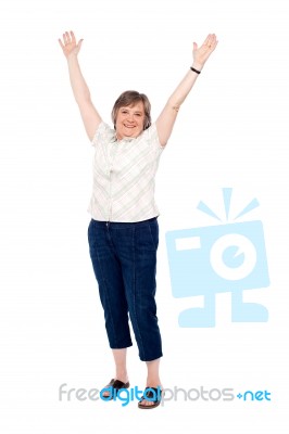 Senior Woman Lifting Her Arms Up Stock Photo