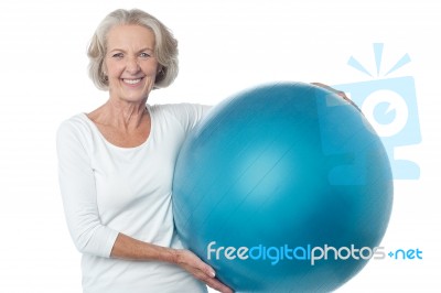 Senior Woman Posing With Exercise Ball Stock Photo