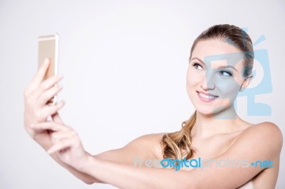 Sensual Young Lady Taking A Selfie Stock Photo