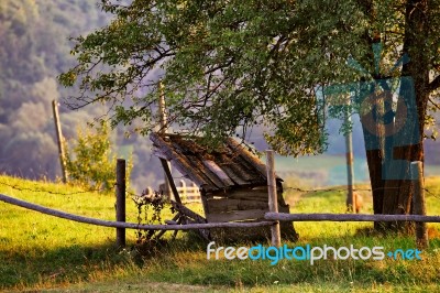 September Rural Scene In Mountains. Authentic Village And Fence Stock Photo