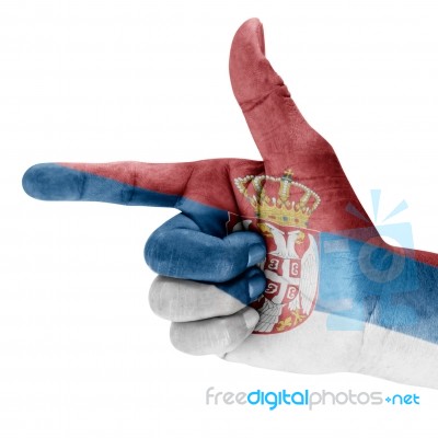Serbia Flag On Shooting Hand Stock Photo