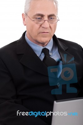 Seriously Working Business Man Stock Photo