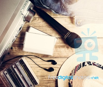 Set Of Audio Device On Wooden Background Stock Photo
