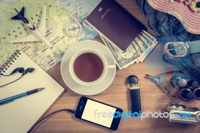 Set Of Travel Accessory On Wooden Background Stock Photo