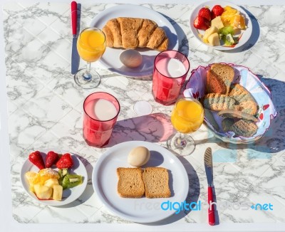 Set Table With Food And Drink For Breakfast Stock Photo