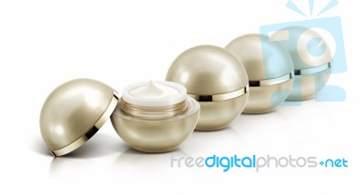 Several Golden Sphere Cosmetic Jar On White Background Stock Photo