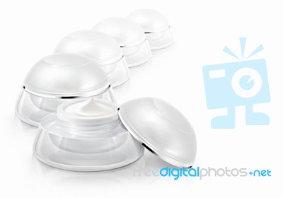 Several White Rounded Cosmetic Jar On White Background Stock Photo