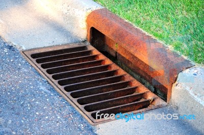 Sewer By Footpath Stock Photo