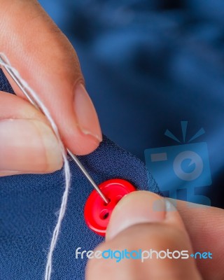Sewing Button Means Stitchwork Textiles And Seamstress Stock Photo
