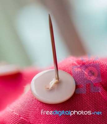 Sewing Button Means Thread Tailor And Needles Stock Photo