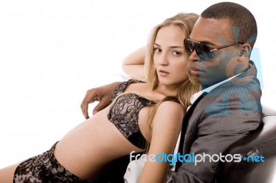 Sexy Lady Lying On Man In Couch Stock Photo