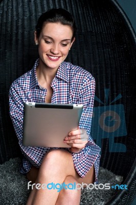 Sexy Woman Browsing On Touch Pad Device Stock Photo
