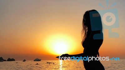 Sexy Young Woman Silhouette In The Sunset Stock Photo