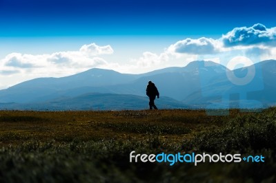 Shadow Of Lonely Traveller In Norway Background Stock Photo