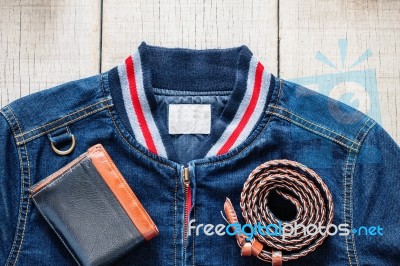 Shirt Of Blue Jeans On Wooden Stock Photo
