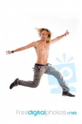 Shirtless Male Jumping In Joy Stock Photo