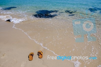 Shoes On The Beach Stock Photo