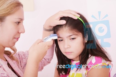 Sick Child Checking By Mother Stock Photo