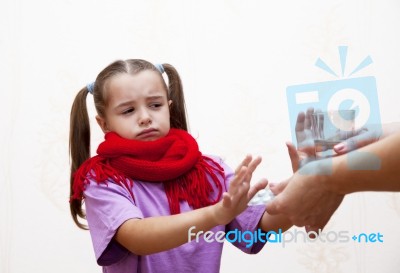 Sick Girl Refuses To Take The Medicine From Her Mother Stock Photo
