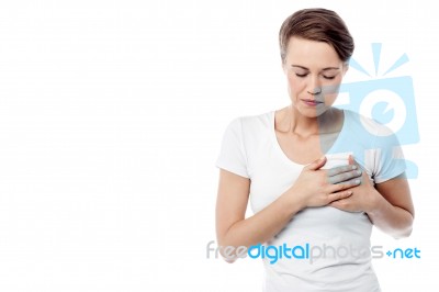 Sick Woman Suffers From Chest Pain Stock Photo