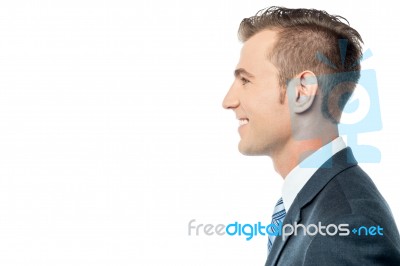 Side Pose Of A Young Businessman Stock Photo