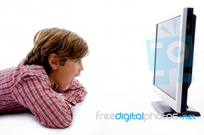 Side Pose Of Boy Watching Lcd Screen Stock Photo