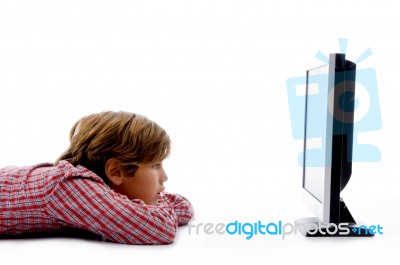Side Pose Of Boy Watching Tv Stock Photo