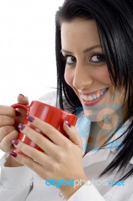 Side Pose Of Doctor Holding Mug On White Background Stock Photo