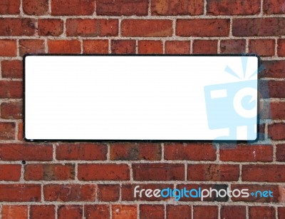 Sign On A Brick Wall Stock Photo