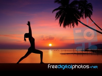 Silhouette Girl Doing Yoga Stock Photo