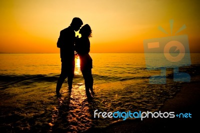 Silhouette Of A Couple Stock Photo