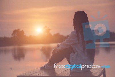 Silhouette Of Relaxing Young Woman Stock Photo