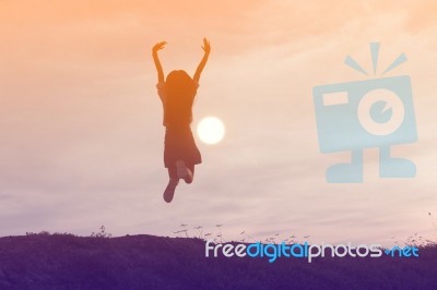 Silhouette Of Woman Praying Over Beautiful Sky Background Stock Photo