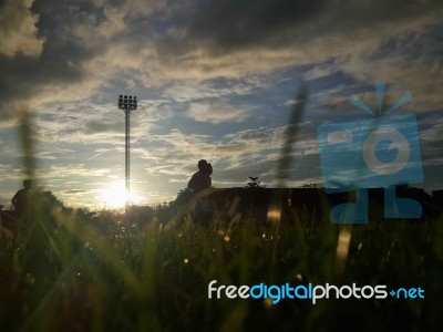 Silhouette  Running On Road At Sunrise Stock Photo