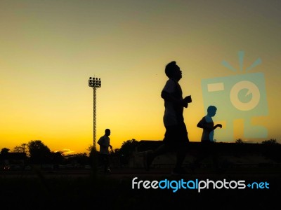 Silhouette Teen Age Run Together  Track Stock Photo