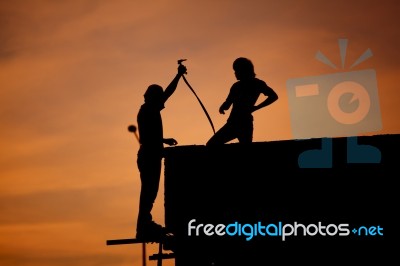 Silhouettes Of Worker Welder Stock Photo