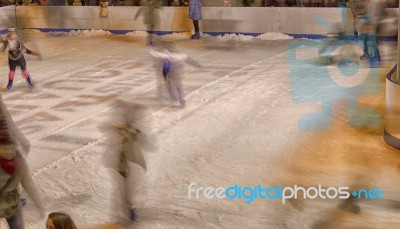 Silhouettes On The Ice Rink Stock Photo