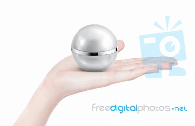 Silver Sphere Cosmetic Jar On Hand Isolated Stock Photo