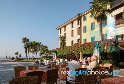 Sirmione, Lake Garda/italy - October 27 : People Relaxing In Caf… Stock Photo