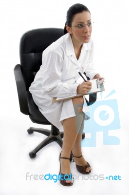 Sitting Doctor With clipboard Stock Photo