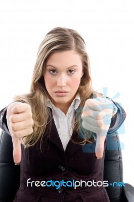 Sitting Female With Thumbs Down Stock Photo